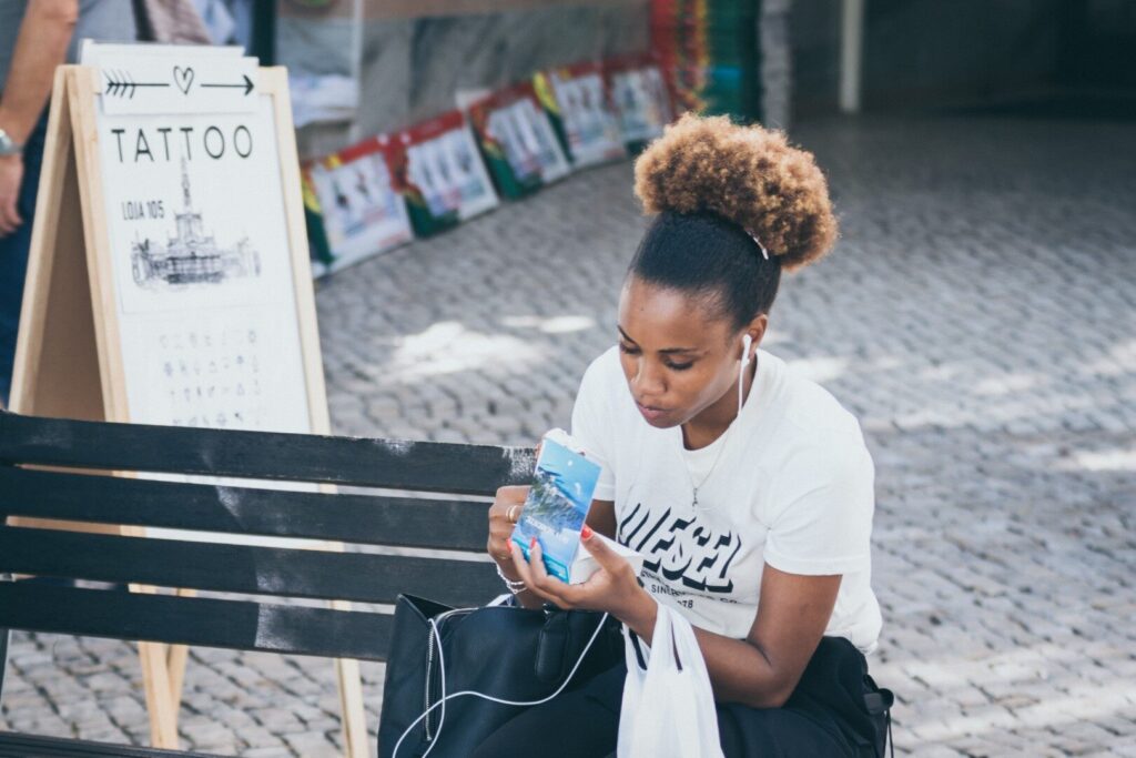 A young woman reading a Gospel leaflet