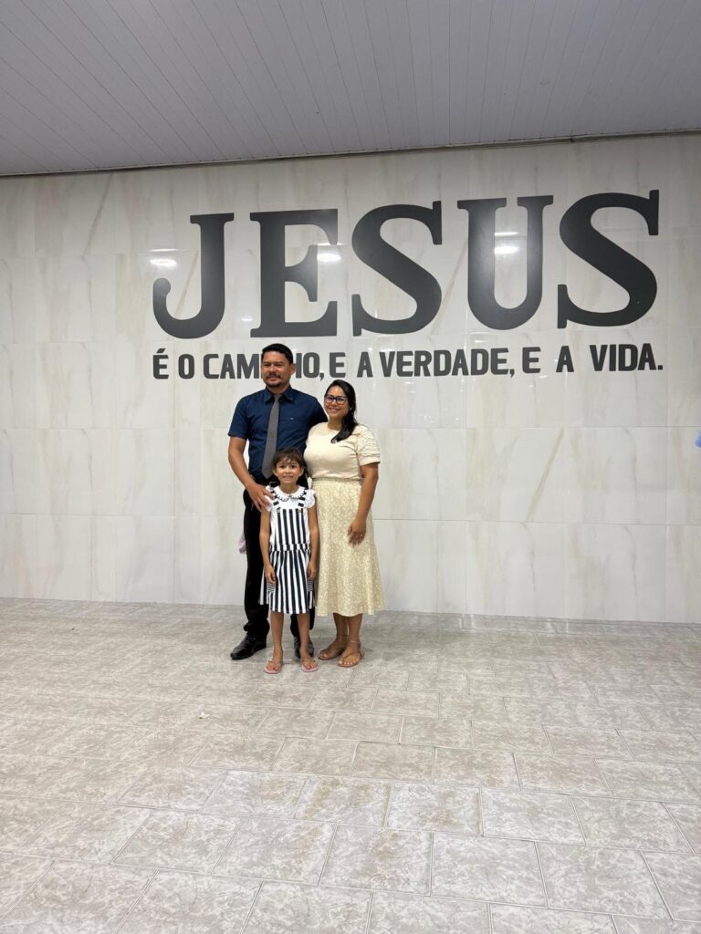 Siatan and his family in the church in Canutama